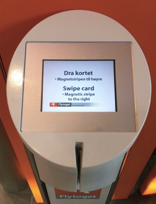 The Oslo train ticket machine, with a screen saying 'Swipe card' and a single slot